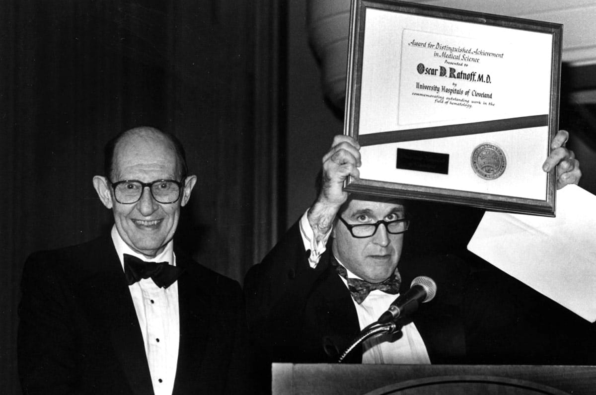 Oscar Ratnoff, MD (right) receiving an award
