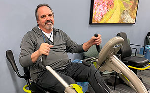 Mike Zappitello using an exercise machine