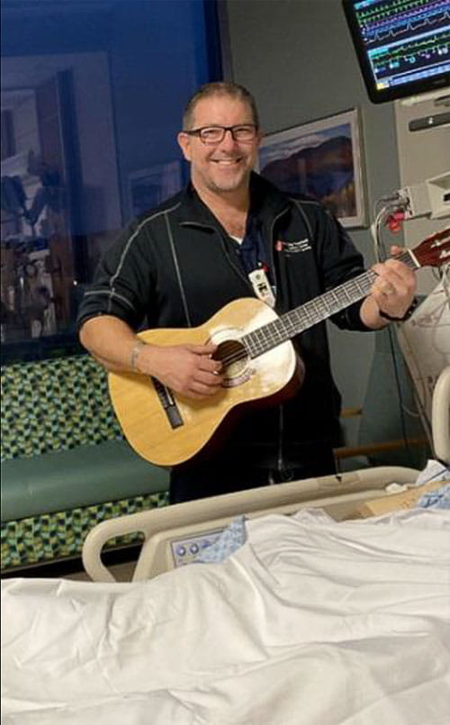 Eric Drvenkar, RN and his guitar