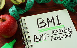 BMI body mass index formula written on a notepad sheet