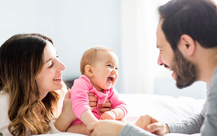 parents laughing with child