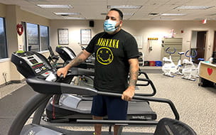 David Diaz stands on a treadmill