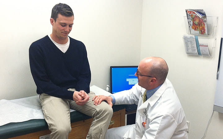 John Dickens being examined by Dr. Sean Cupp