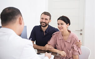 Man and woman meeting with doctor