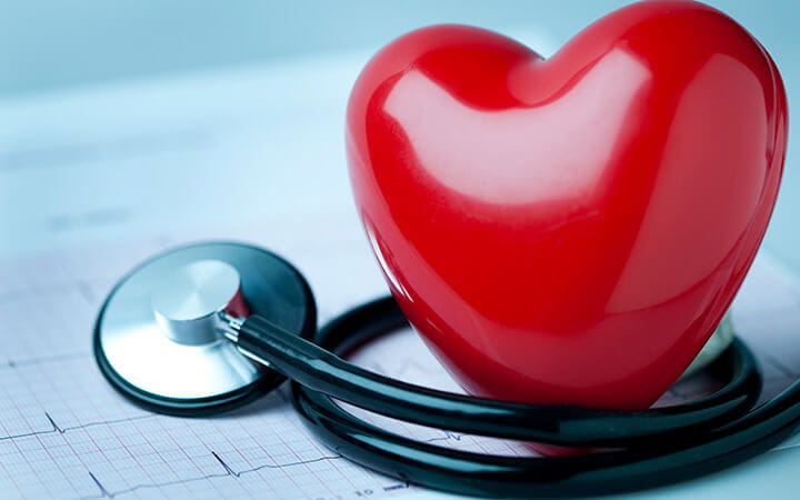 A heart shape on an electrocardiogram with a stethoscope