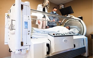 Patient in a hyperbaric oxygen chamber