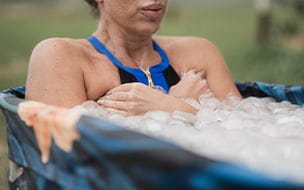 woman takes ice water bath