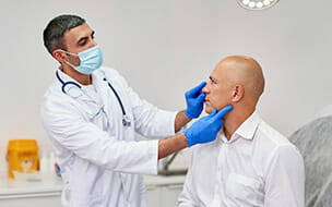 Man meeting with plastic surgeon before operation in clinic