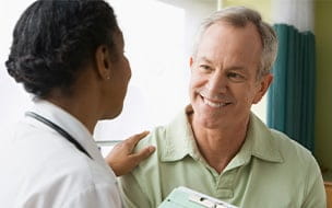 Mature man talking to a doctor