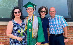 Graduate Joshua Miller with his family