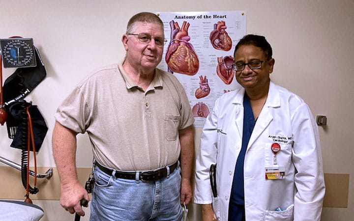 Anjan Gupta, MD with patient William Moulton after performing the thrombectomy procedure.