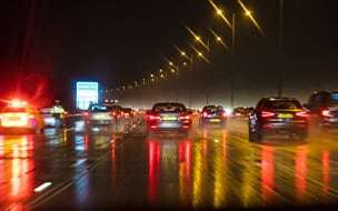 Motion blurred photograph of traffic at in night in the rain on a British motorway