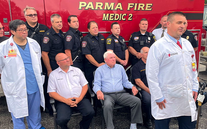 Bill Regan pictured with Parma Fire Department and Paul Poommipanit, MD