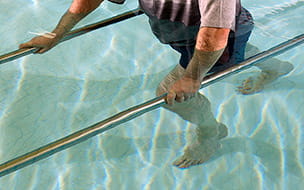 Man having physical therapy in pool