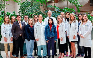 Mary Rose Sessler stands with UH team members who performed her heart-lung transplant