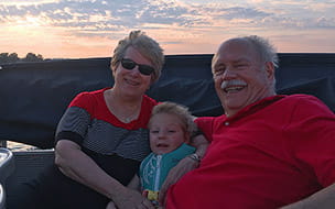 Ken and Mary Alice Sikora enjoy a summer evening with their grandson