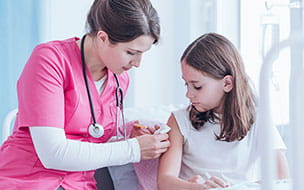 doctor giving vaccine