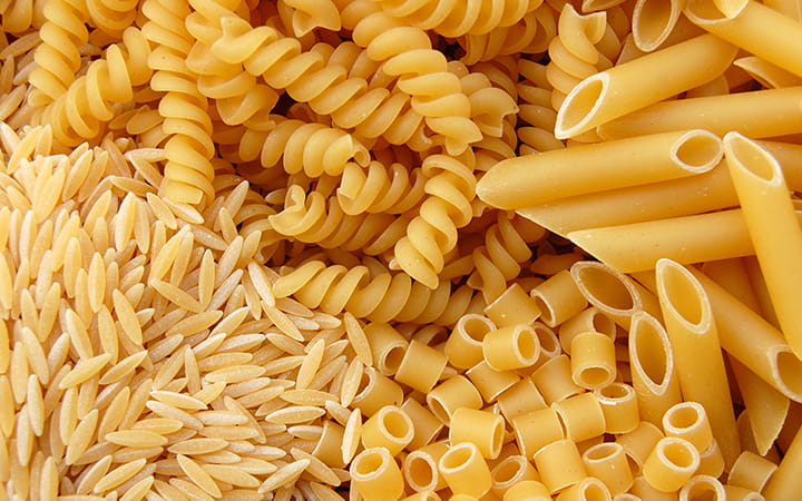 Full background of a variety of pasta noodles