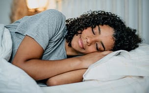 A young woman sleeping in bed