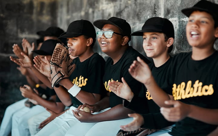 Youth baseball players in dugout