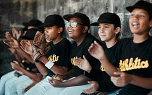 Youth baseball players in dugout