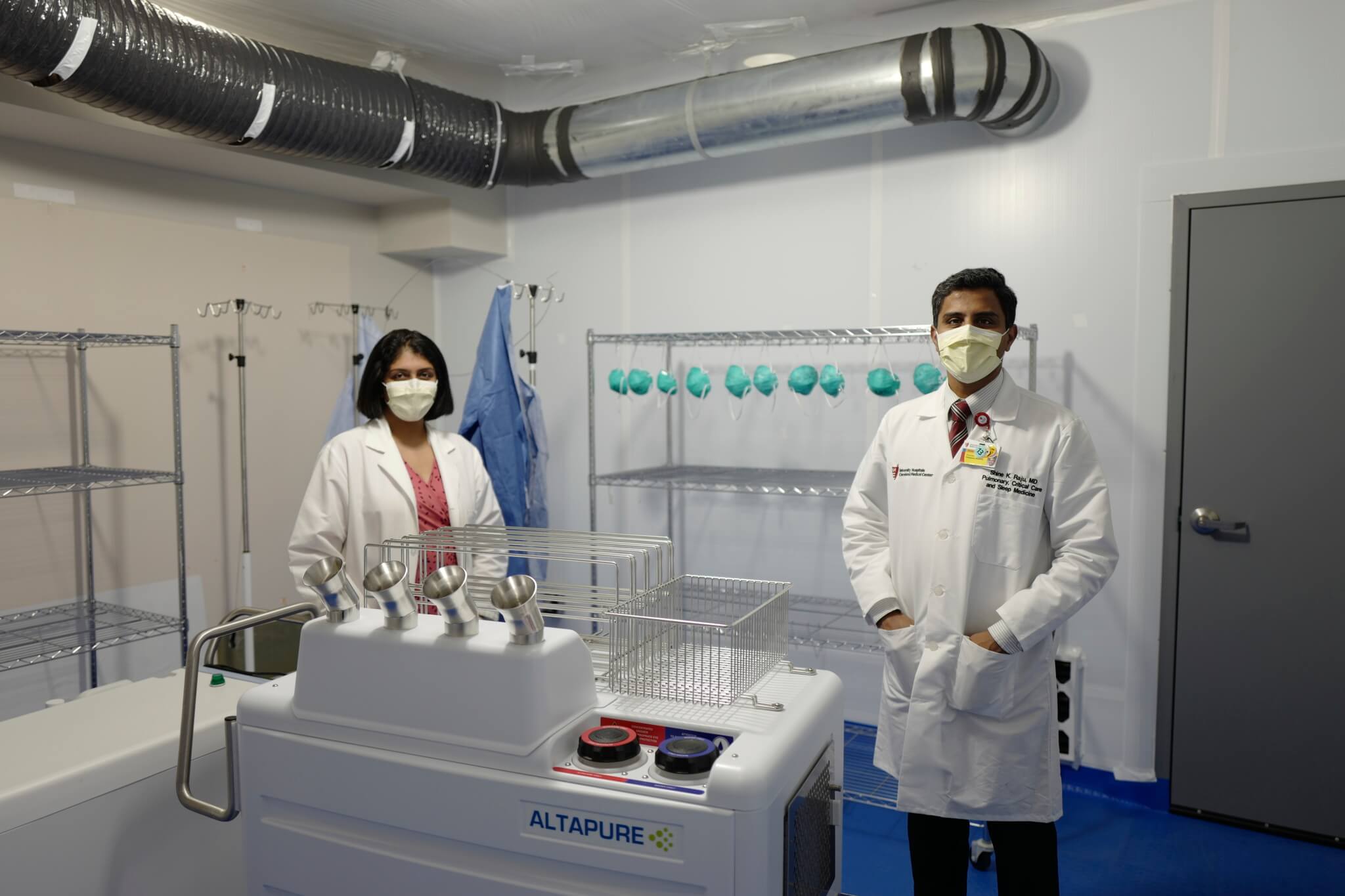 Dr. Shine Raju and Dr. Amrita John with the peracetic aerosolization device