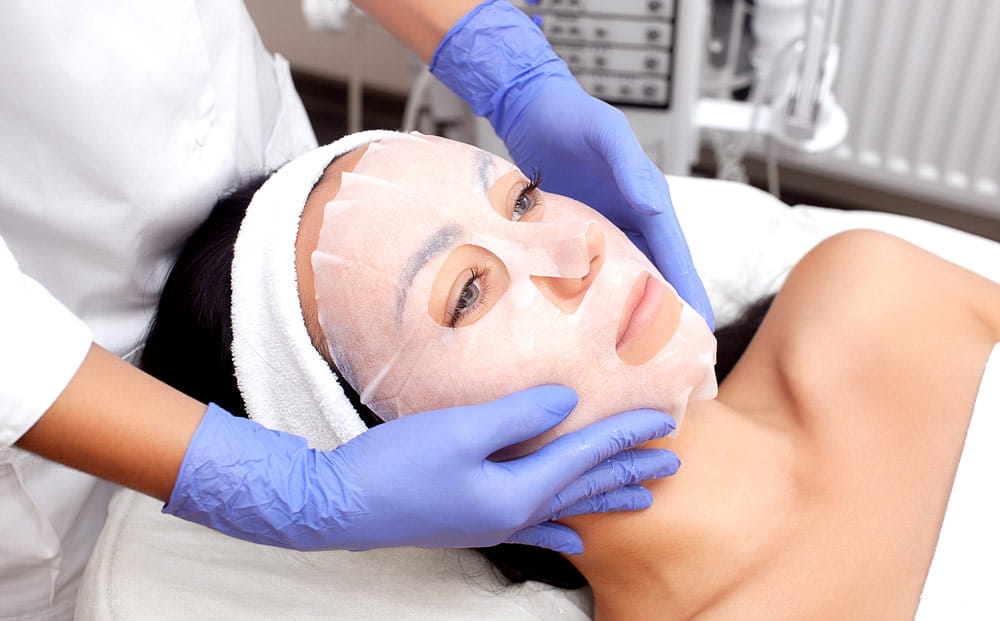 A woman receiving treatment after cosmetic surgery