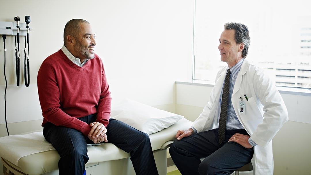 physician talking with male patient