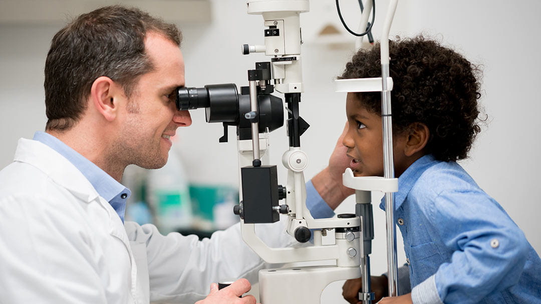 doctor examining girls eyes