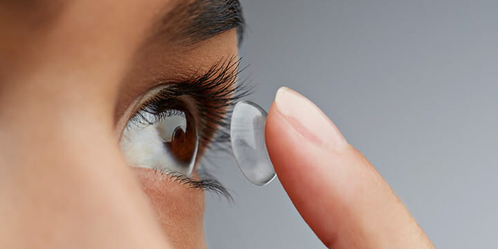 lady putting in contacts