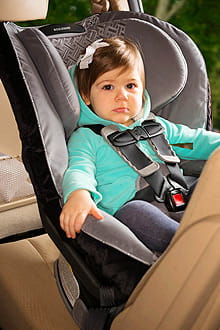 Child in car seat.