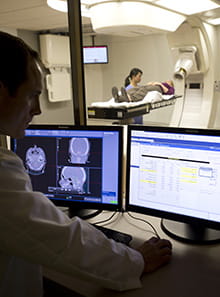 UH Seidman Cancer Center - Services - Proton Therapy - man looking at computer screen