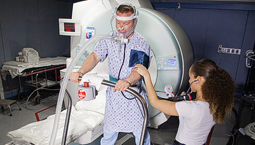 A patient being evaluated with the one-of-a-kind exercise MRI