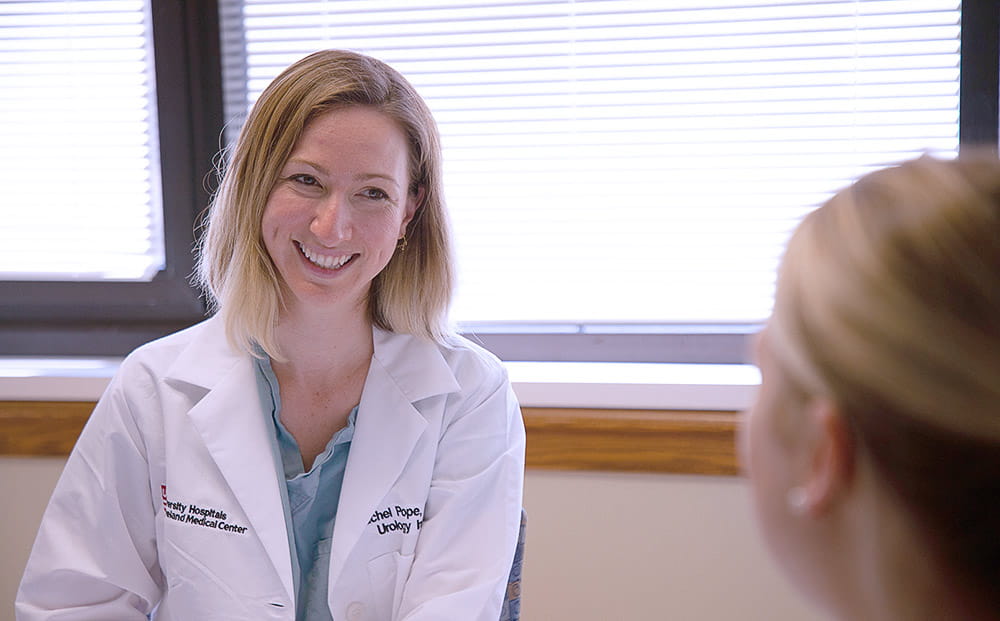 Rachel Pope, MD, MPH consults with a patient