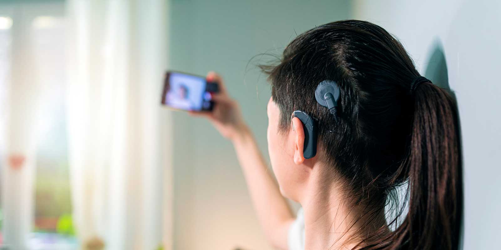 Young woman with cochlear implant