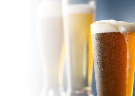 A selection of beer glasses and bottles