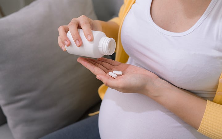 Pregnant woman taking medication