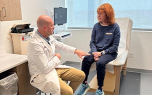 Ben Boswell, DO consults with Phyllis Marino