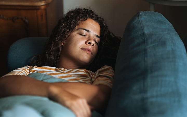woman asleep on couch