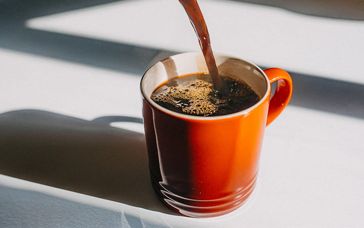 Coffee pouring in a mug