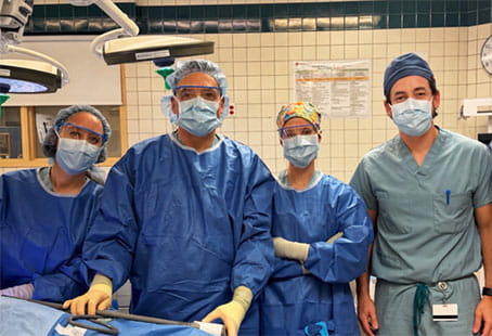 Leonidas Tapias, MD, and the UH surgical team in the OR.