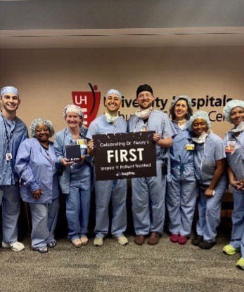 Thomaz Fleury, MD with ENT team members holding sign recognizing his Inspire physician excellence recognition.