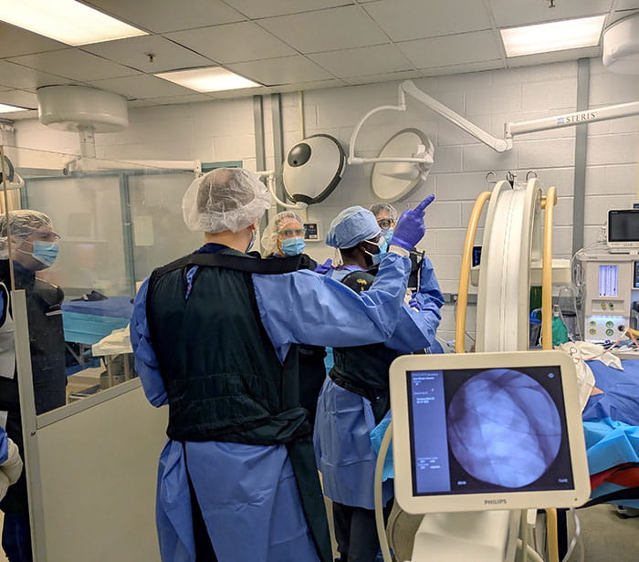 High-fidelity human cadaver-based simulation is used to train pulmonary and critical care medicine fellows fluoroscopically guided transbronchial biopsy. Additionally, equipment has been set up to simulate hemoptysis with subsequent bronchial blocker placement for management.