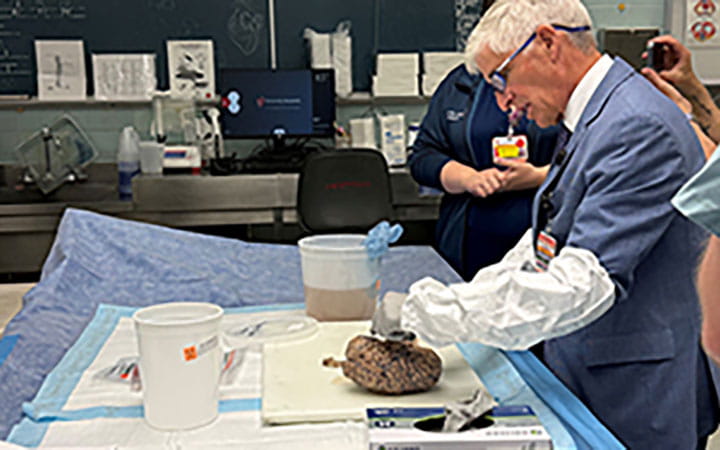 Dan Simon, MD in UH Morgue with pathology team.