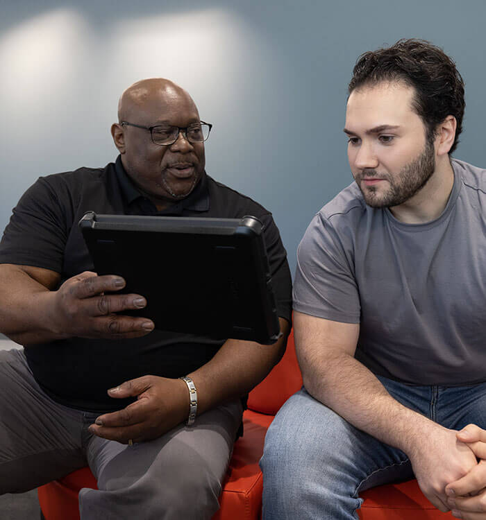 Two men sitting on bench at UH Cutler Center for Men's Health