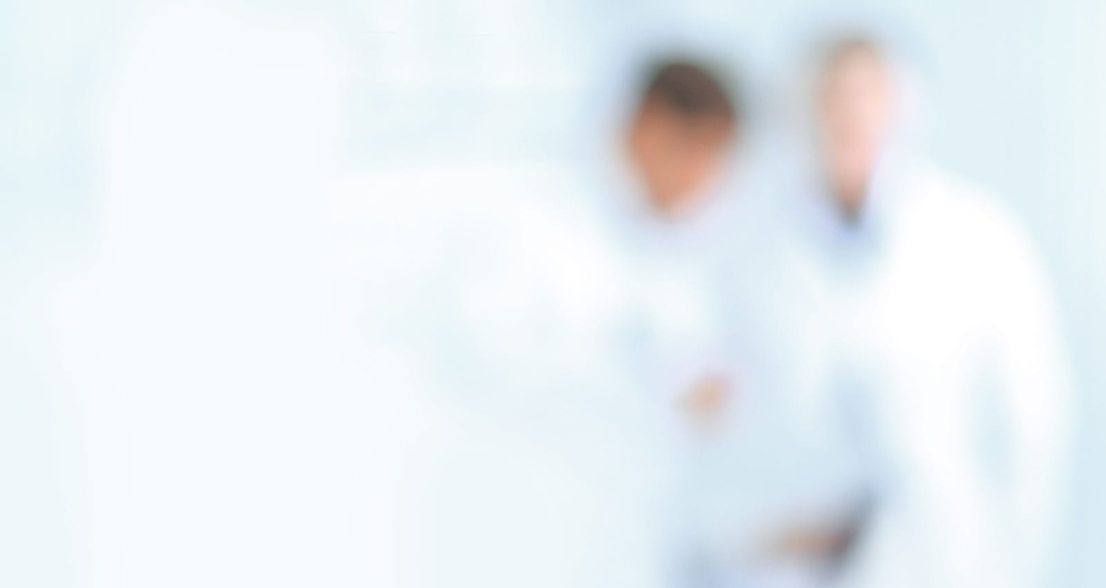 Blurry image of doctors standing in the hospital corridor