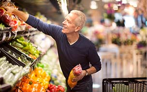 Senior man goes grocery shopping