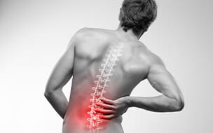 Male torso seen from behind illustrating lower back pain