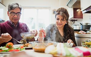 Mature Couple Enjoying Dinner at Home