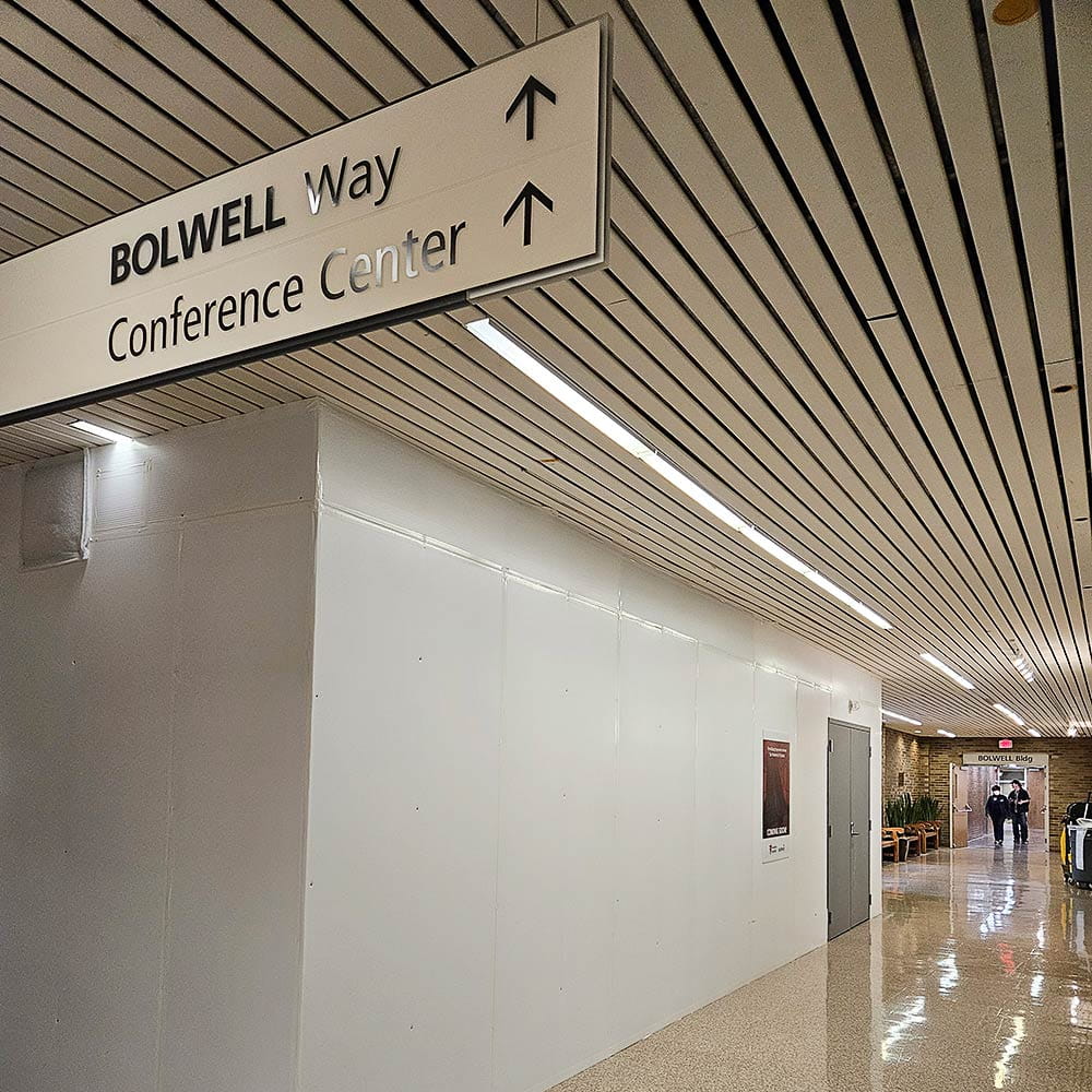 Directions to the escalator located at the end of the Trudy Weisenberg art gallery